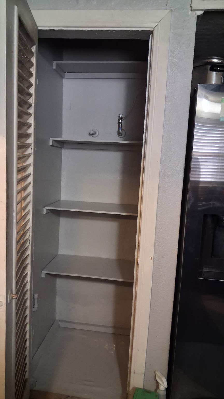 Completed storage area with built-in shelves